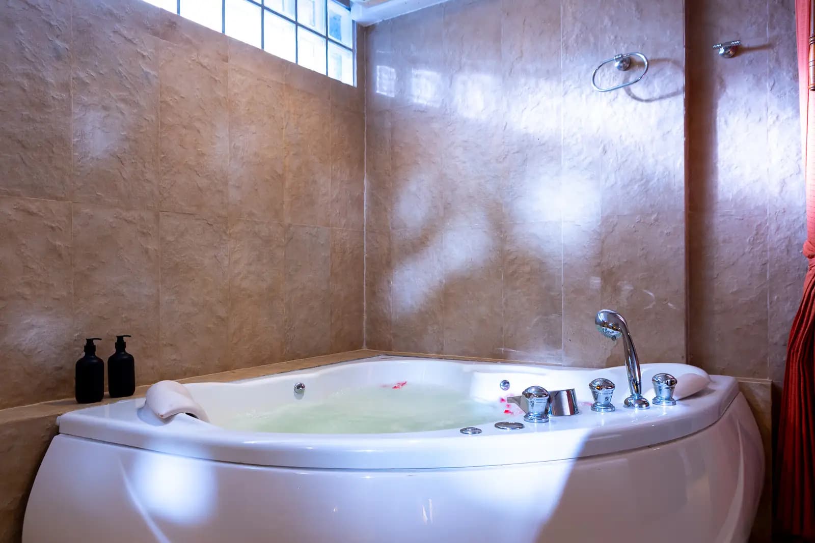 Jacuzzi facility at The Nai Harn Collective boutique villa hotel in Phuket - Our underground spa is a sanctuary for the senses, featuring a sauna, steam room, and jacuzzi.